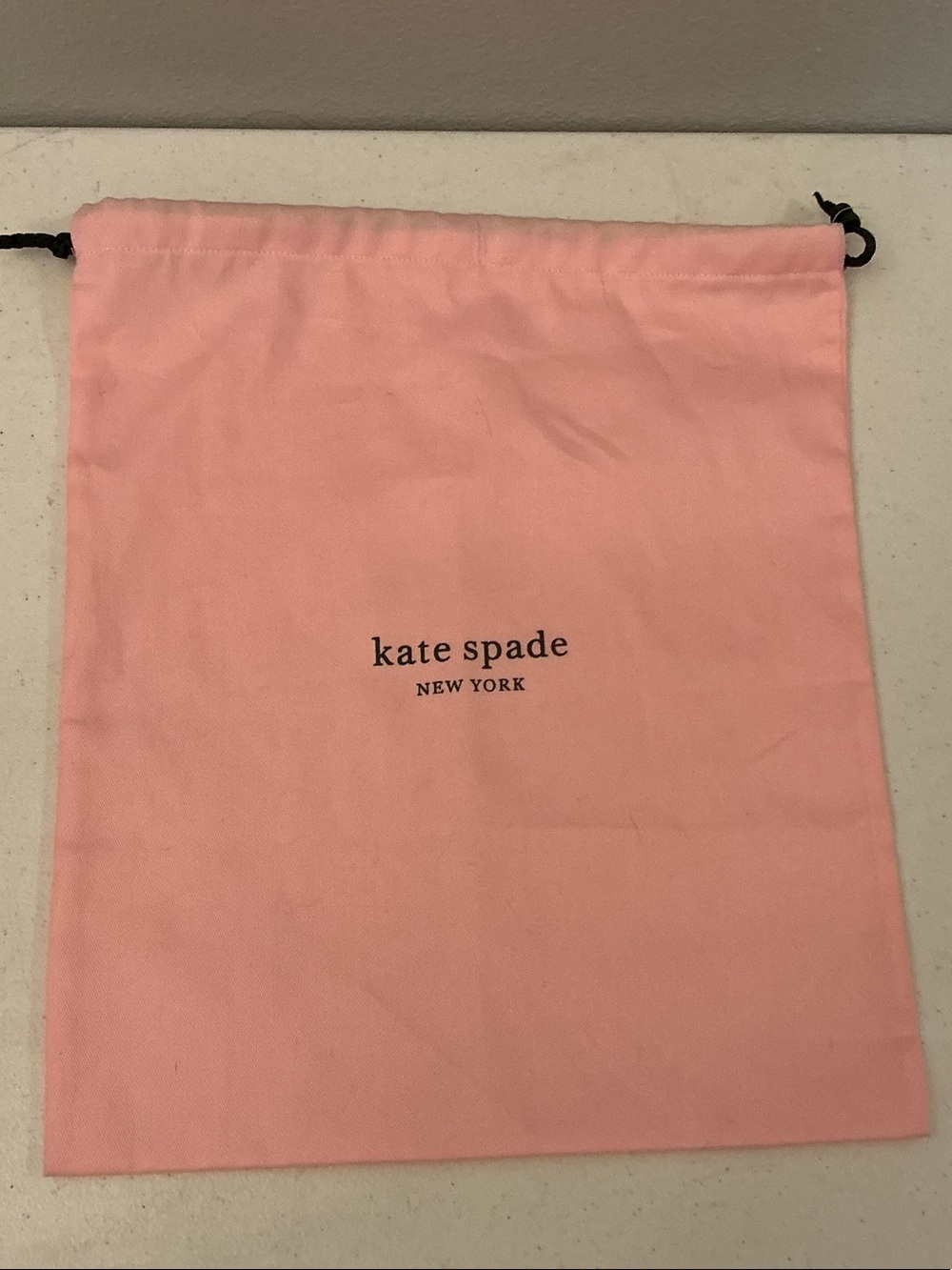kate spade Pink Drawstring Pouch with Black Cord